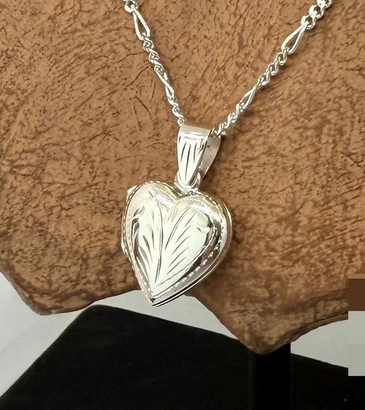 Small sterling silver 925 heart locket. With leaf engraving